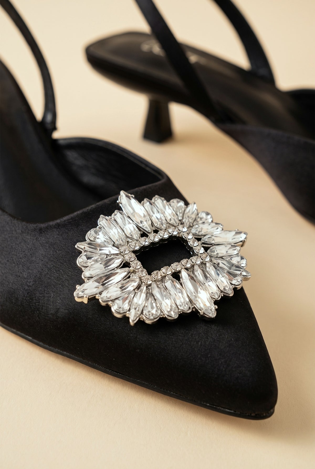 Isabella Low Heel Sandals in black, crystal brooch close up