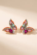 June Butterfly Earrings in Pink: half-butterfly studs with a coral bead border, pink and fuchsia marquise stones, a mint accent stone and AB rhinestones