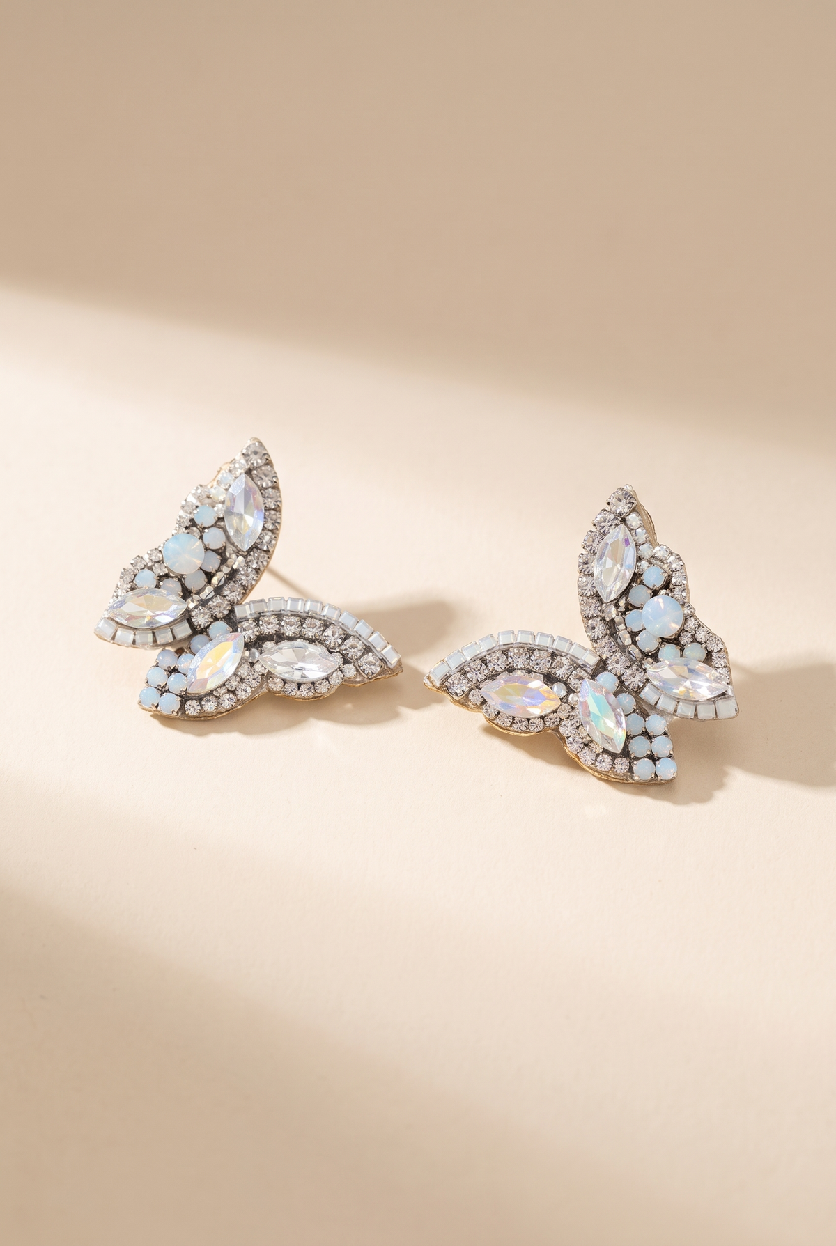 June Butterfly Earrings, White still life