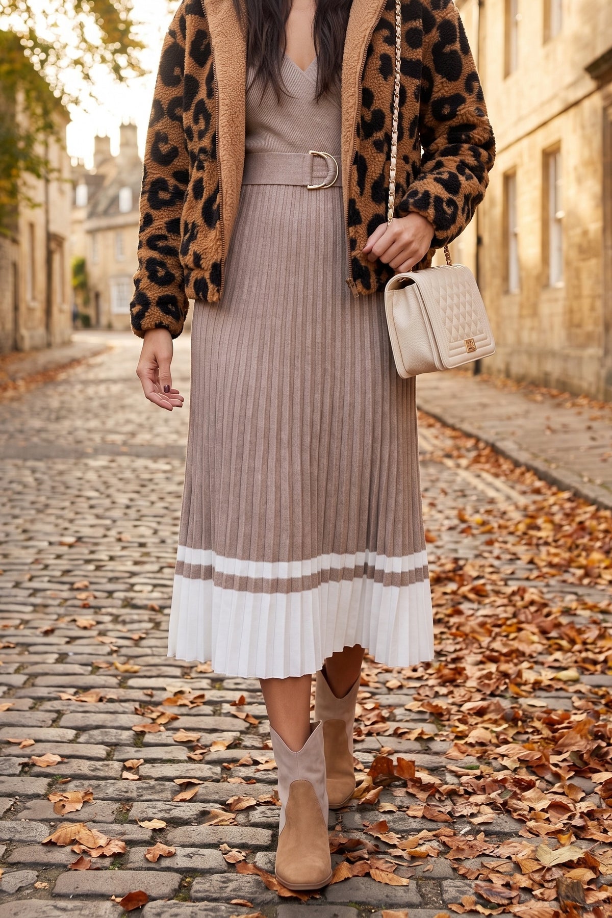 I've Loved You For So Long pleated sweater dress styled for fall with the Going Wild leopard sherpa jacket, Sadie tri-tone booties and the cream Jacqueline quilted bag.