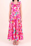 Front view of the Blooming Affair floral maxi dress showing the ruffled straps and neckline, smocked bodice and three tiers falling to the ankle.
