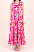 Front view of the Blooming Affair floral maxi dress showing the ruffled straps and neckline, smocked bodice and three tiers falling to the ankle.
