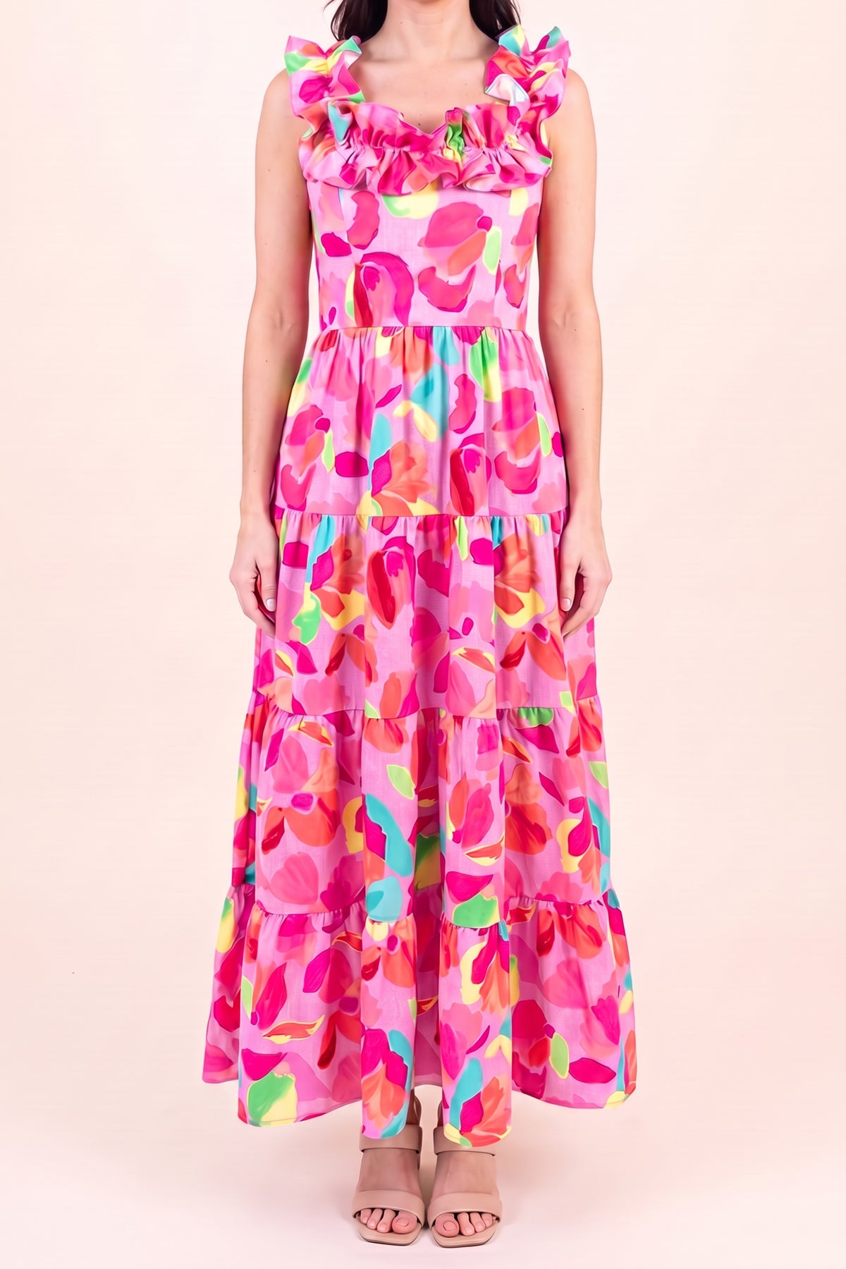 Front view of the Blooming Affair floral maxi dress showing the ruffled straps and neckline, smocked bodice and three tiers falling to the ankle.