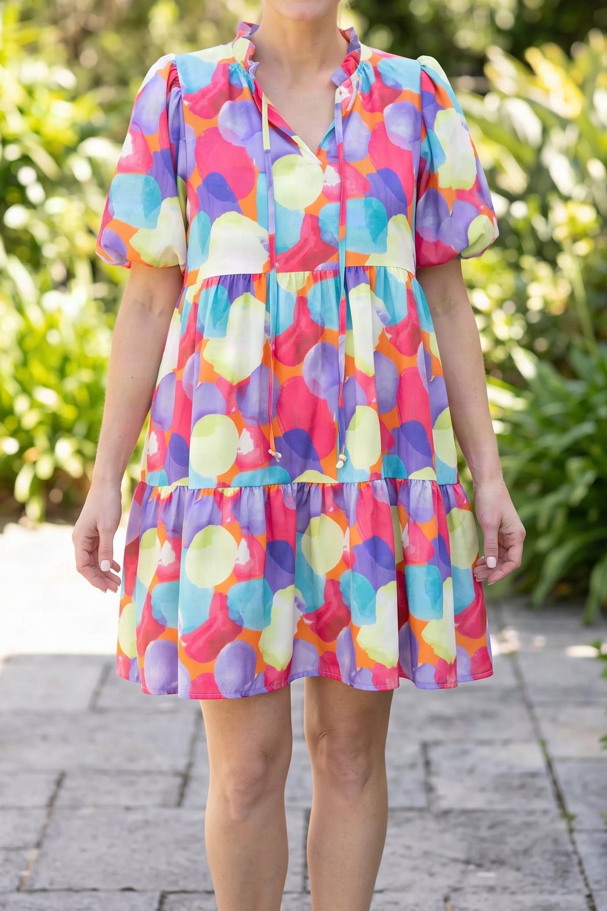 Model wearing the Crush On You multicolour babydoll dress, shown from the chin down