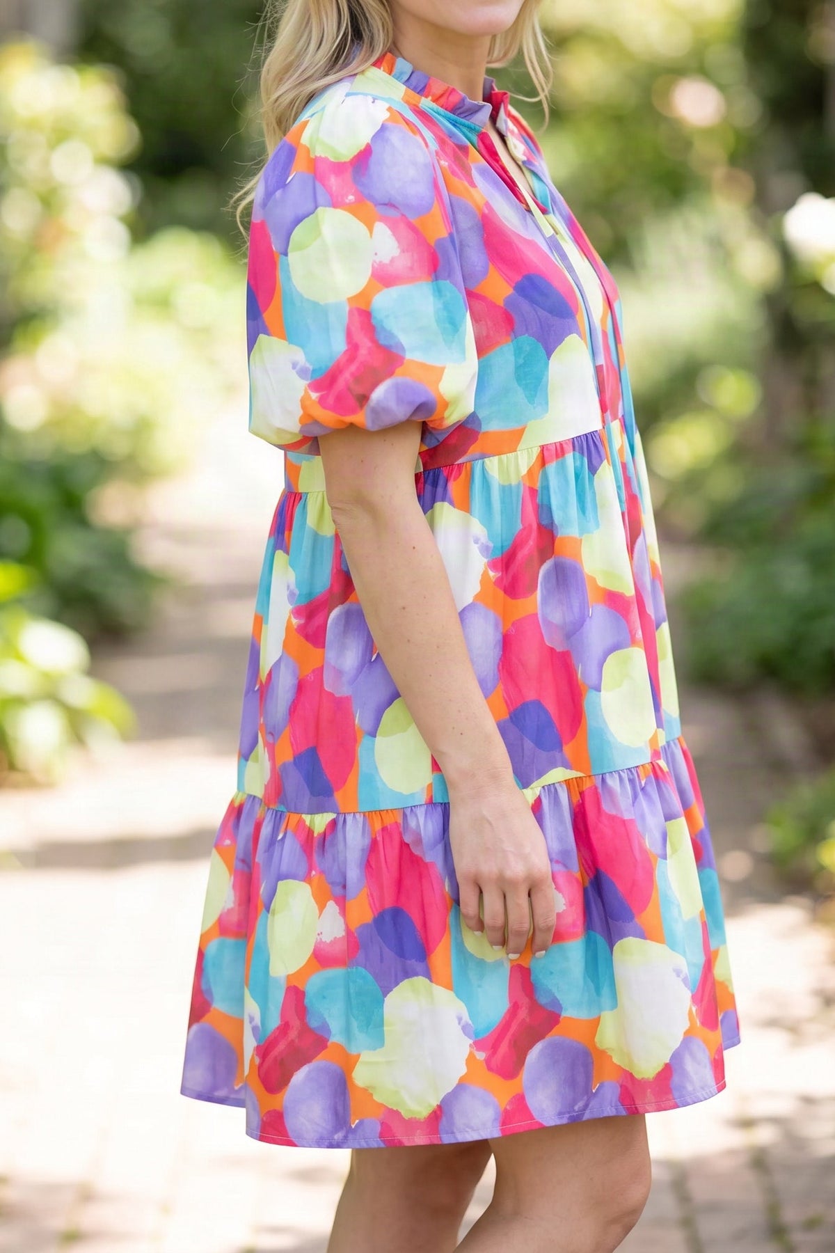 Model wearing the Crush On You multicolour babydoll dress, side view from the chin down