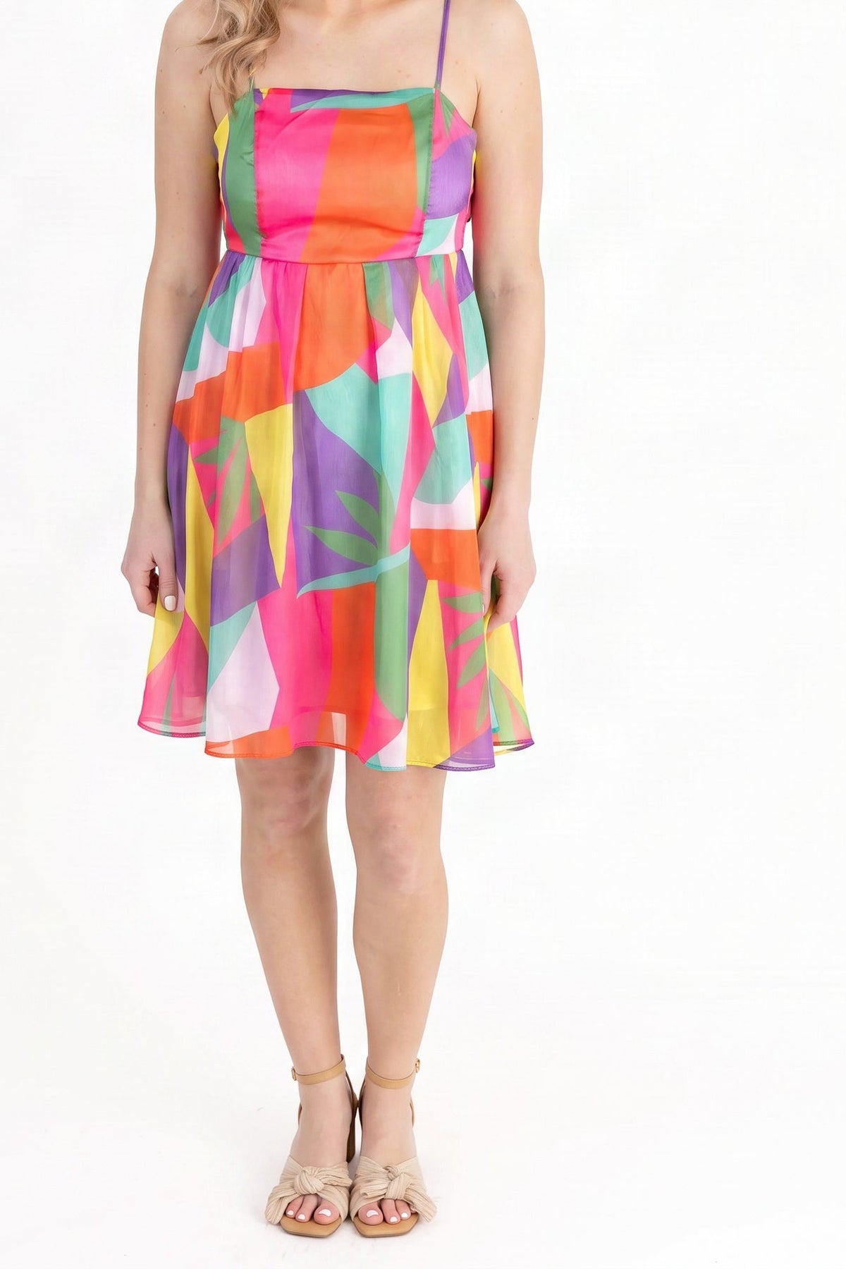 Model wearing the multicolour geometric print summer mini dress, shown from the chin down