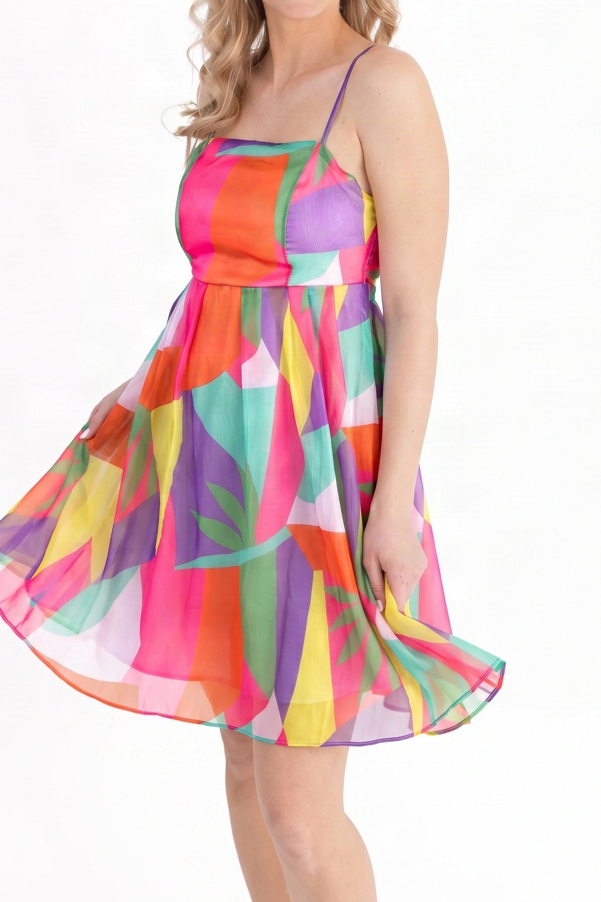 Model wearing the multicolour geometric print summer mini dress, shown from the chin down