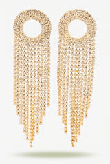 Nancy gold fringe earrings laid flat on a plain light studio background