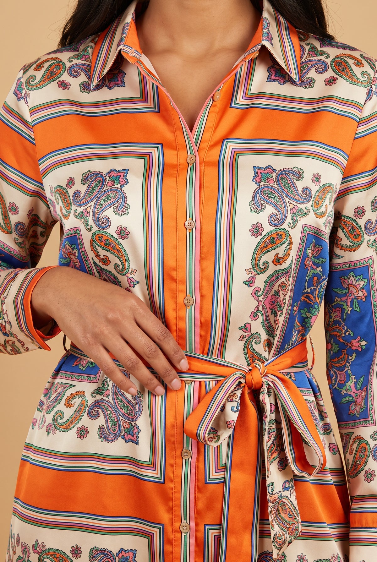 Close-up of the scarf print, collar, button placket and self-tie belt