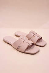 Brittany Flat Slide Sandal, pair of blush nude glossy patent slides with interlocking cage straps and a square open toe