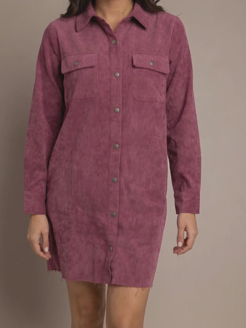 Shweta walking in the Small mauve corduroy shirt dress, showing the structured fabric and raw hem in motion.