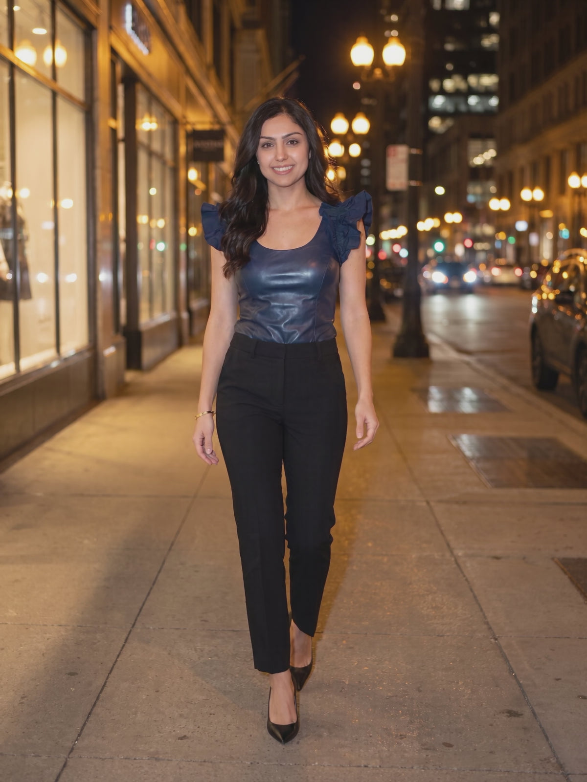 After Hours Bodysuit worn by Shweta at a city street at night, stepping forward and turning to show the back and the fit.