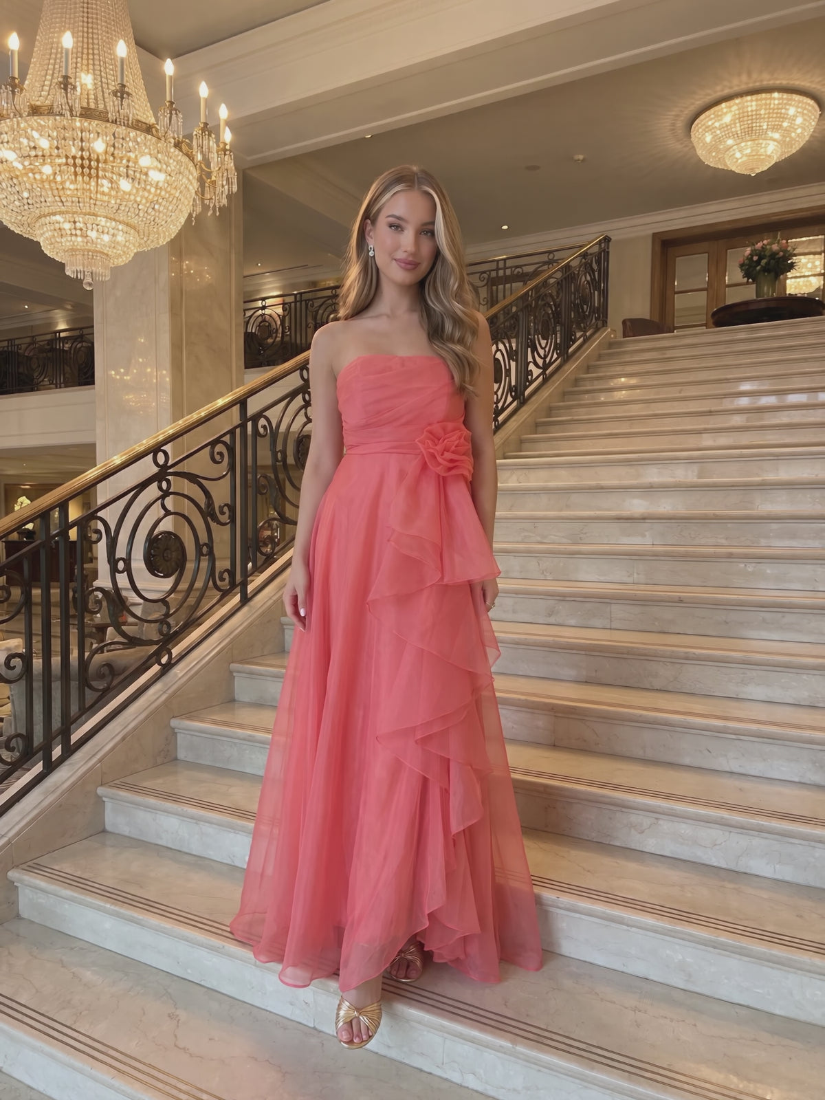 Red Carpet Ready Organza Maxi Dress worn by Sofia at a grand hotel staircase, stepping forward and turning to show the back and the fit.