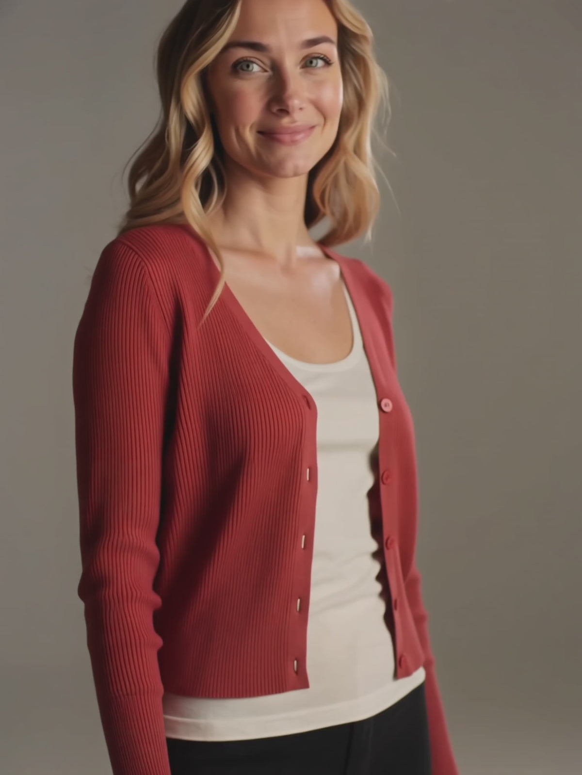 Red I Don't Care Cardigan Sweater moving naturally as Elsa adjusts the open front.