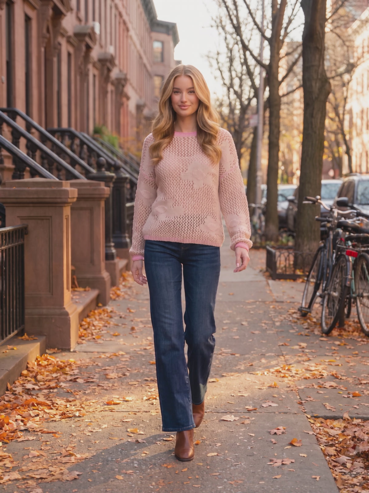 Flower Power Floral Sweater worn by Sofia at an autumn city street, stepping forward and turning to show the back and the fit.