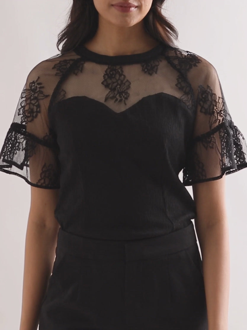 Midnight Madness black lace top moving from a front view to a shallow angle on Shweta in Small.