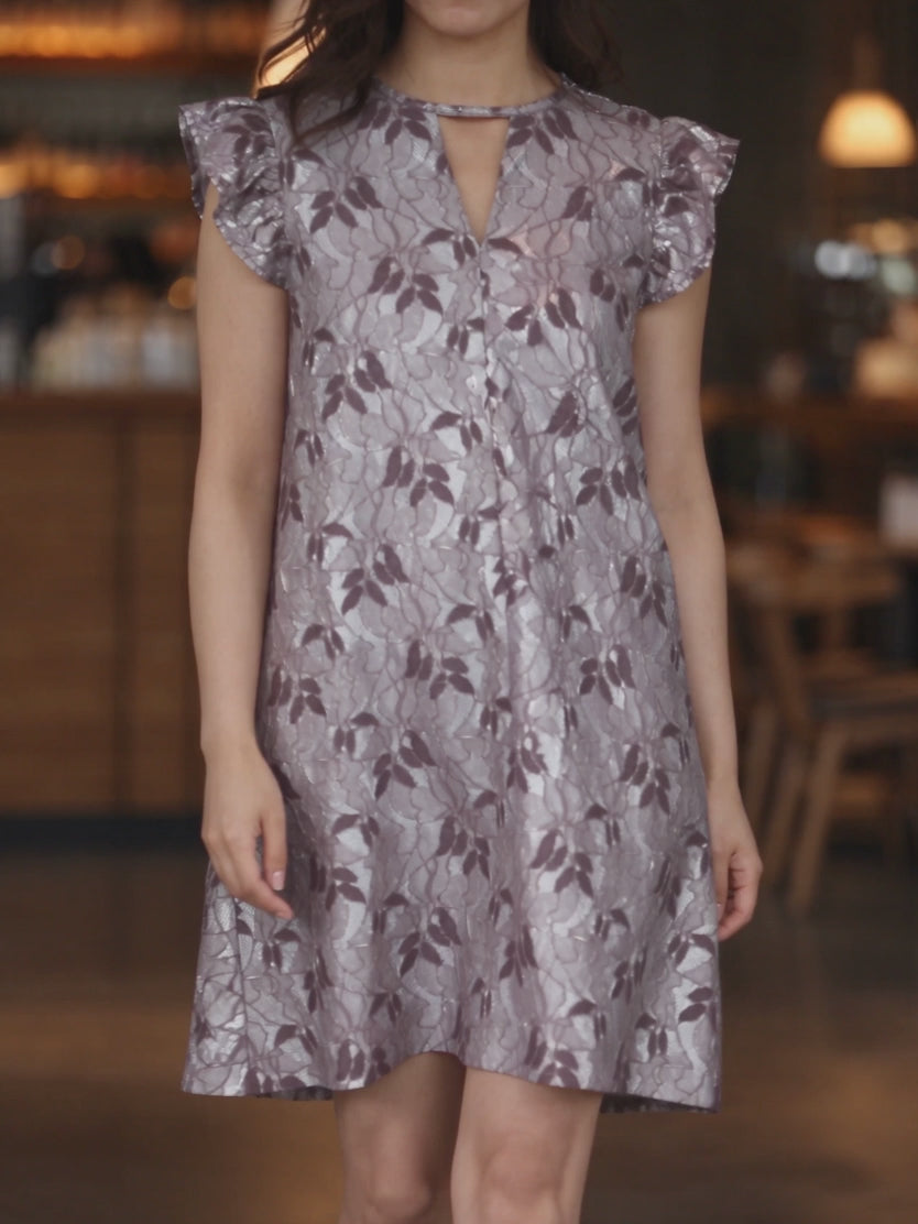Lavender shift dress in motion, showing the flutter sleeves and gently swinging knee-length hem.