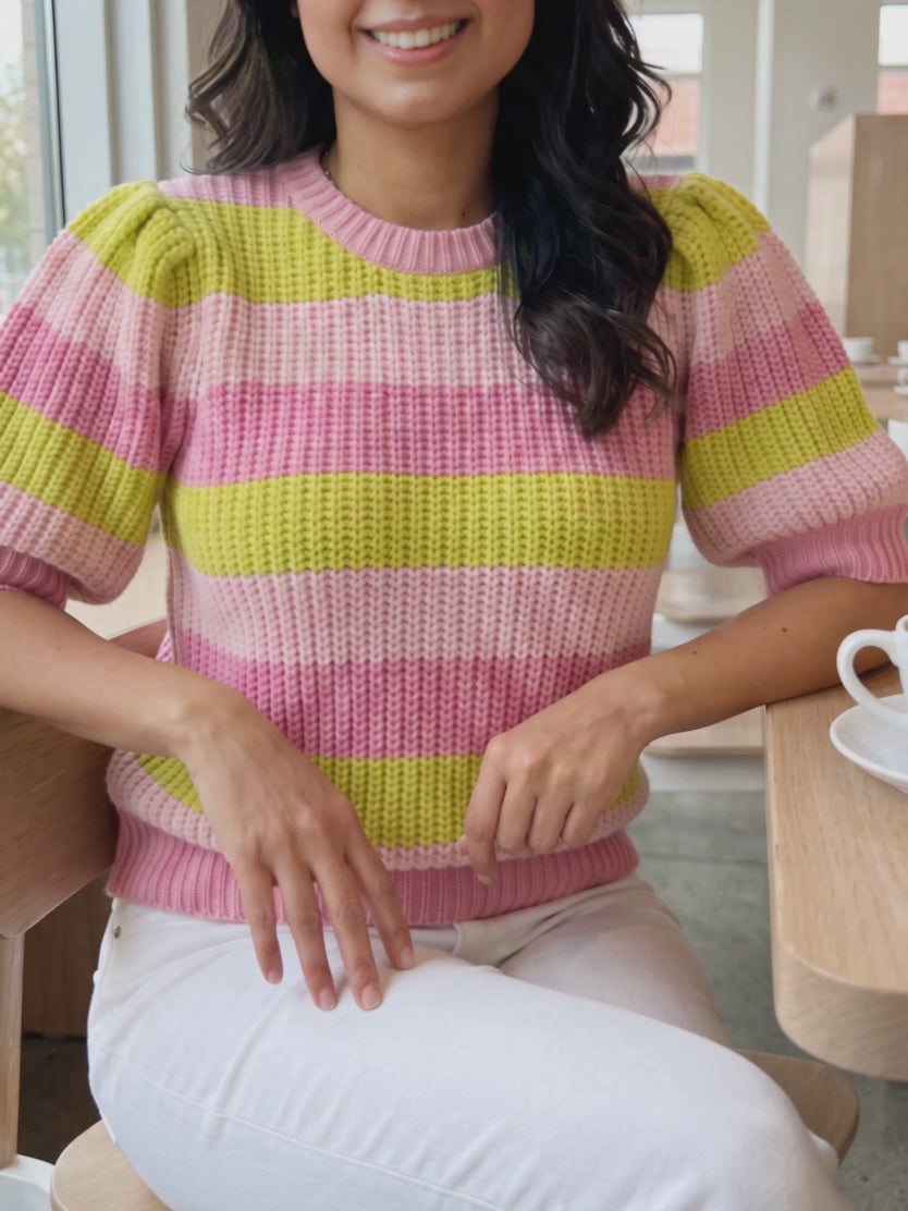 Share Your Story Sweater Top in Small moving naturally during a seated café moment.