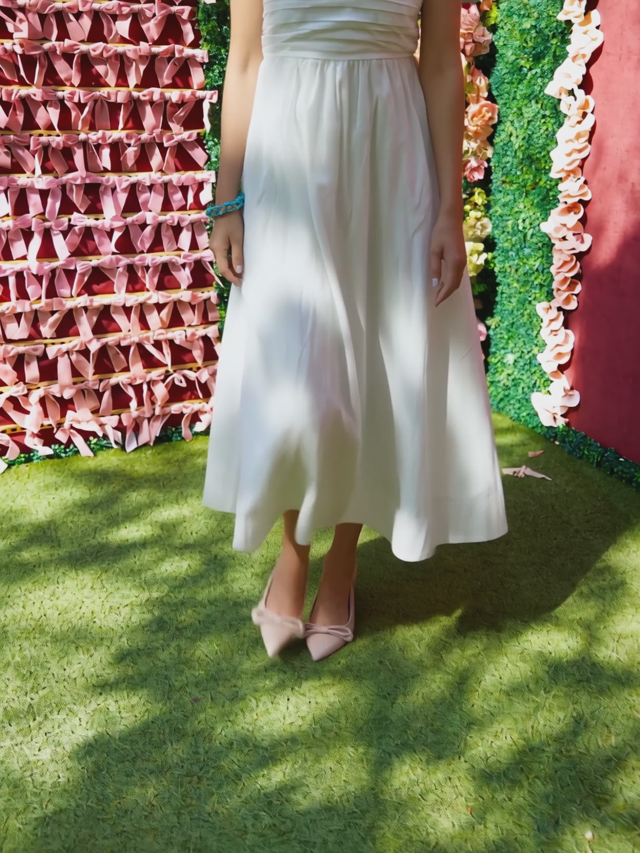 Love Actually White Pleated Midi Dress moving gently to show the gathered skirt's structured drape.