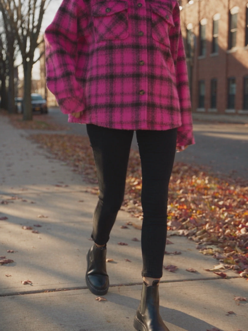 Elsa walking in the Berry Blessed Plaid Shacket, showing its oversized drape in motion.