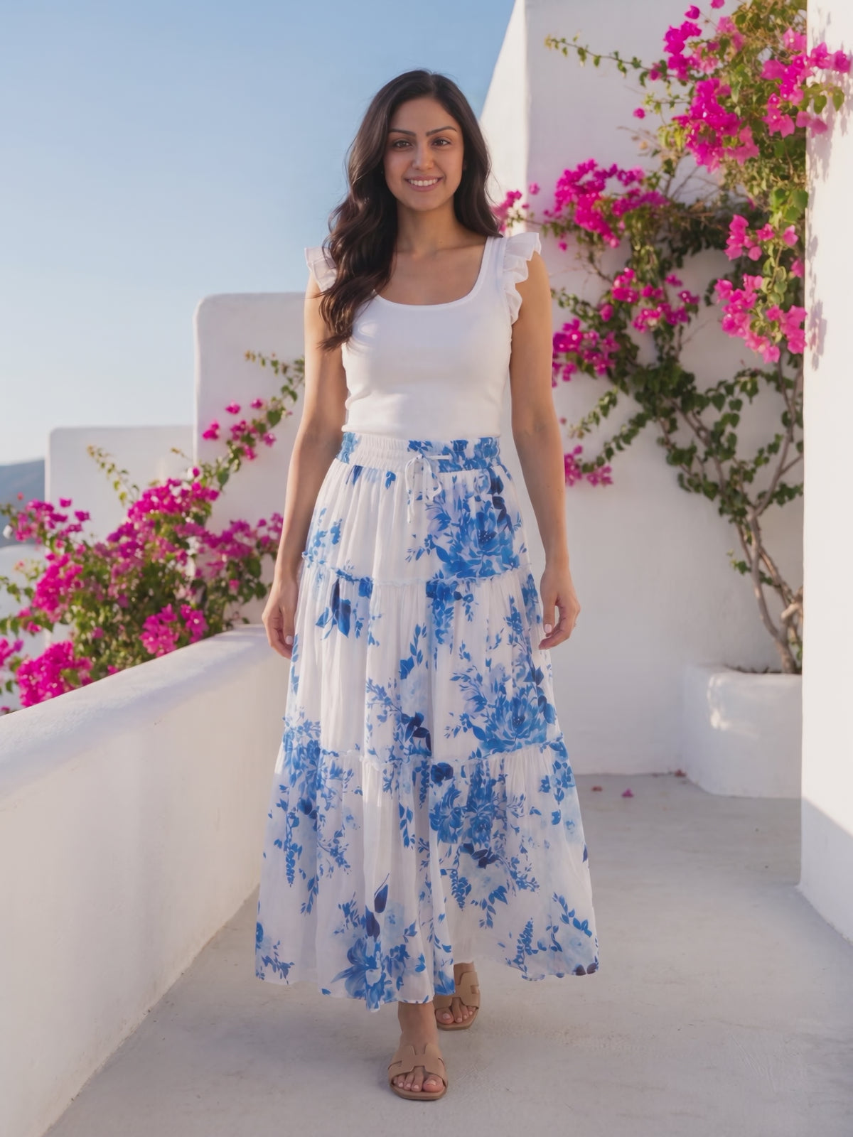 I Love It When You Call Me Señorita Tiered Ruffle Drawstring Maxi Skirt worn by Shweta at a Mediterranean terrace, stepping forward and turning to show the back and the fit.