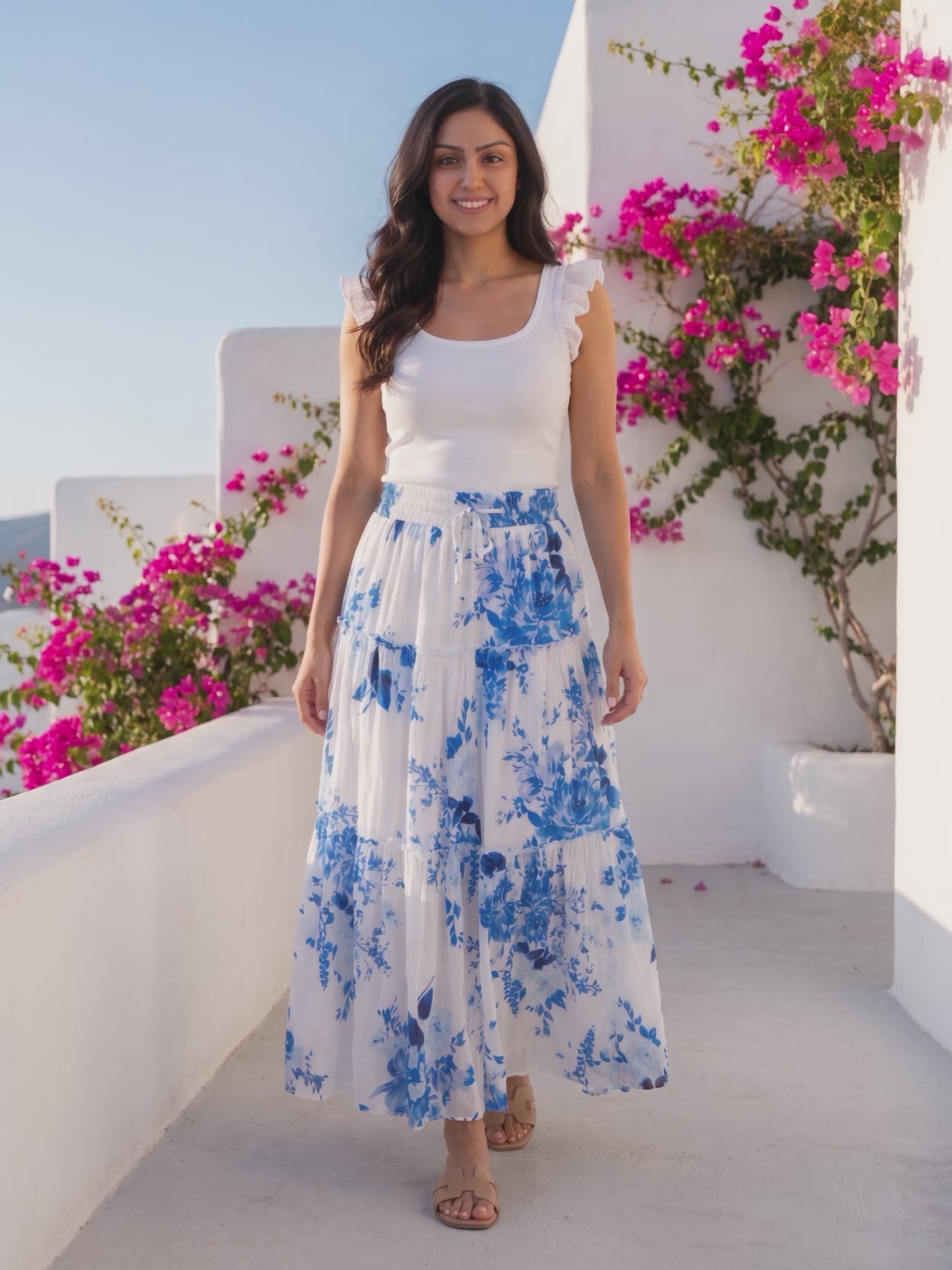I Love It When You Call Me Señorita Tiered Ruffle Drawstring Maxi Skirt worn by Shweta at a Mediterranean terrace, stepping forward and turning to show the back and the fit.