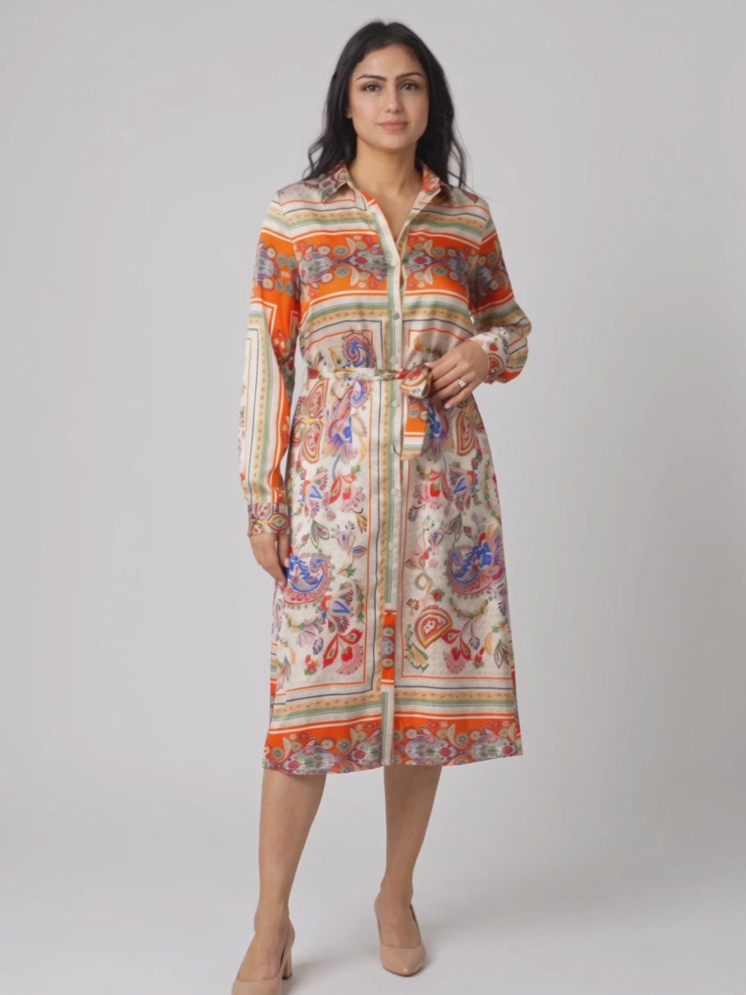 Shweta wears the scarf-print shirt dress while adjusting the tie and walking to show its fluid drape.