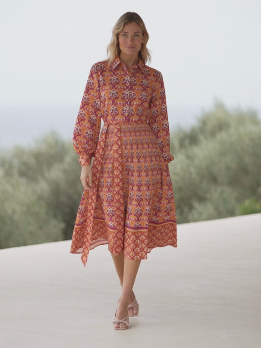Elsa walking and gently turning in the Small shirt dress to show its fit, sleeve volume and skirt movement.
