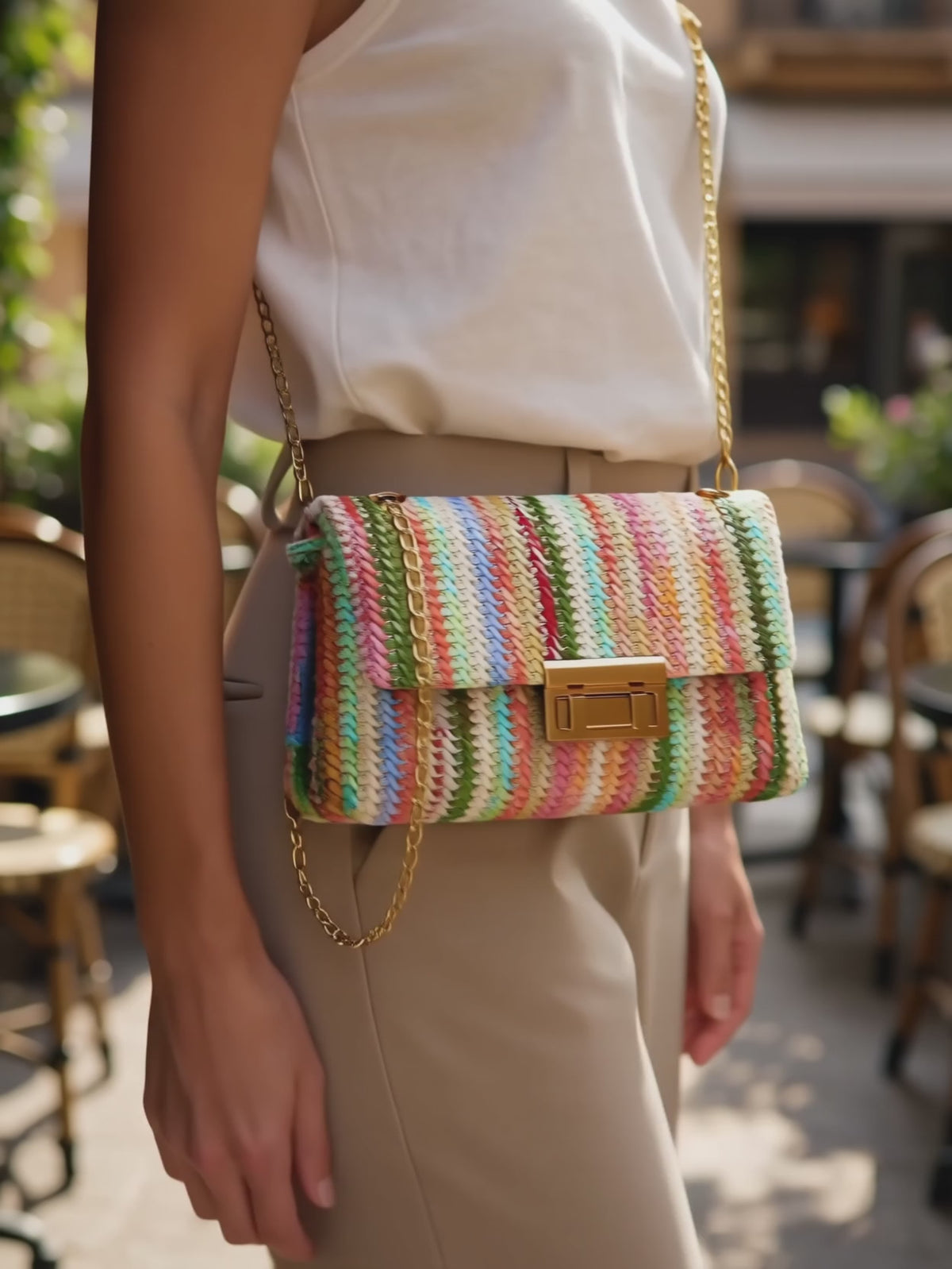 Elsa carrying the Kinsley Crossbody Bag through a sunny vacation brunch setting.