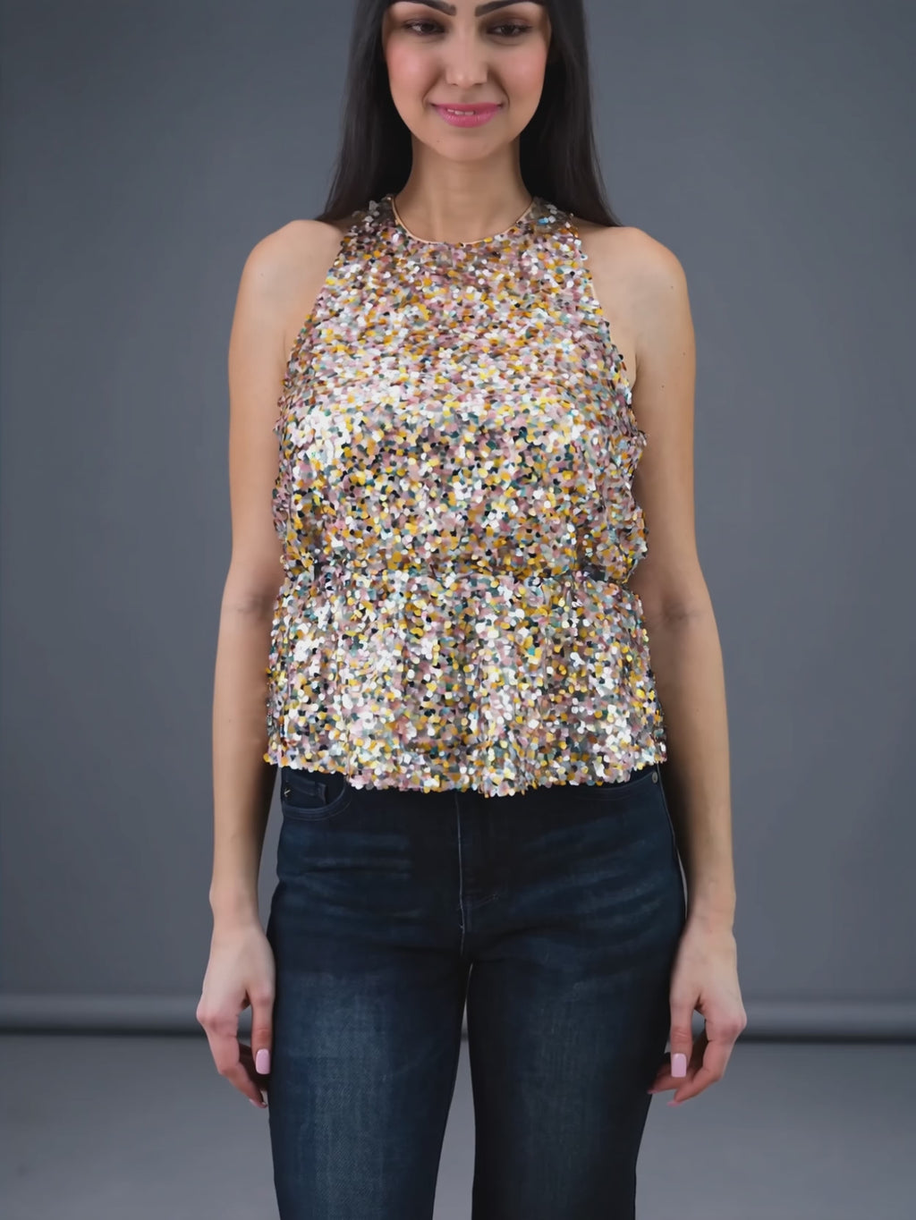 Last Night Sequin Halter Top sparkling as Shweta turns to show the movement of its flared hem.