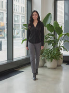 Rolling in the Deep Pleated Top worn by Shweta at a modern office lobby, stepping forward and turning to show the back and the fit.