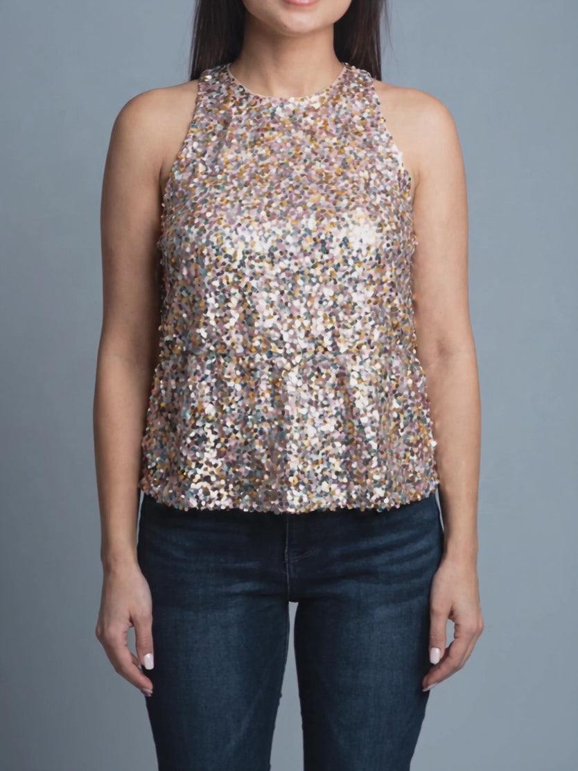 Last Night Sequin Halter Top sparkling as its peplum moves during a gentle turn.