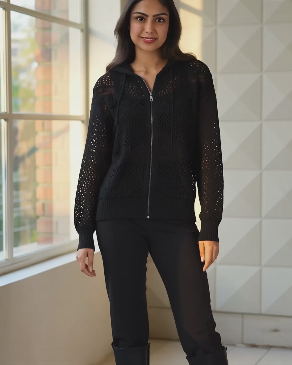 Got My Reasons black crochet zip hoodie moving naturally in a café