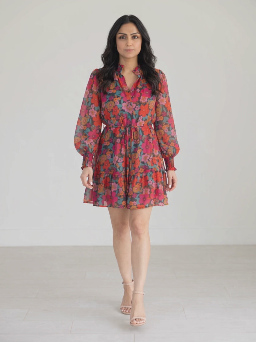 Only If You Knew Floral Dress in Small moving gently to show the skirt swing and airy sleeves.