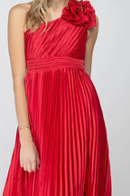Close-up of the ruffle rosette, pleated satin bodice and banded waist of the red One More Night maxi dress