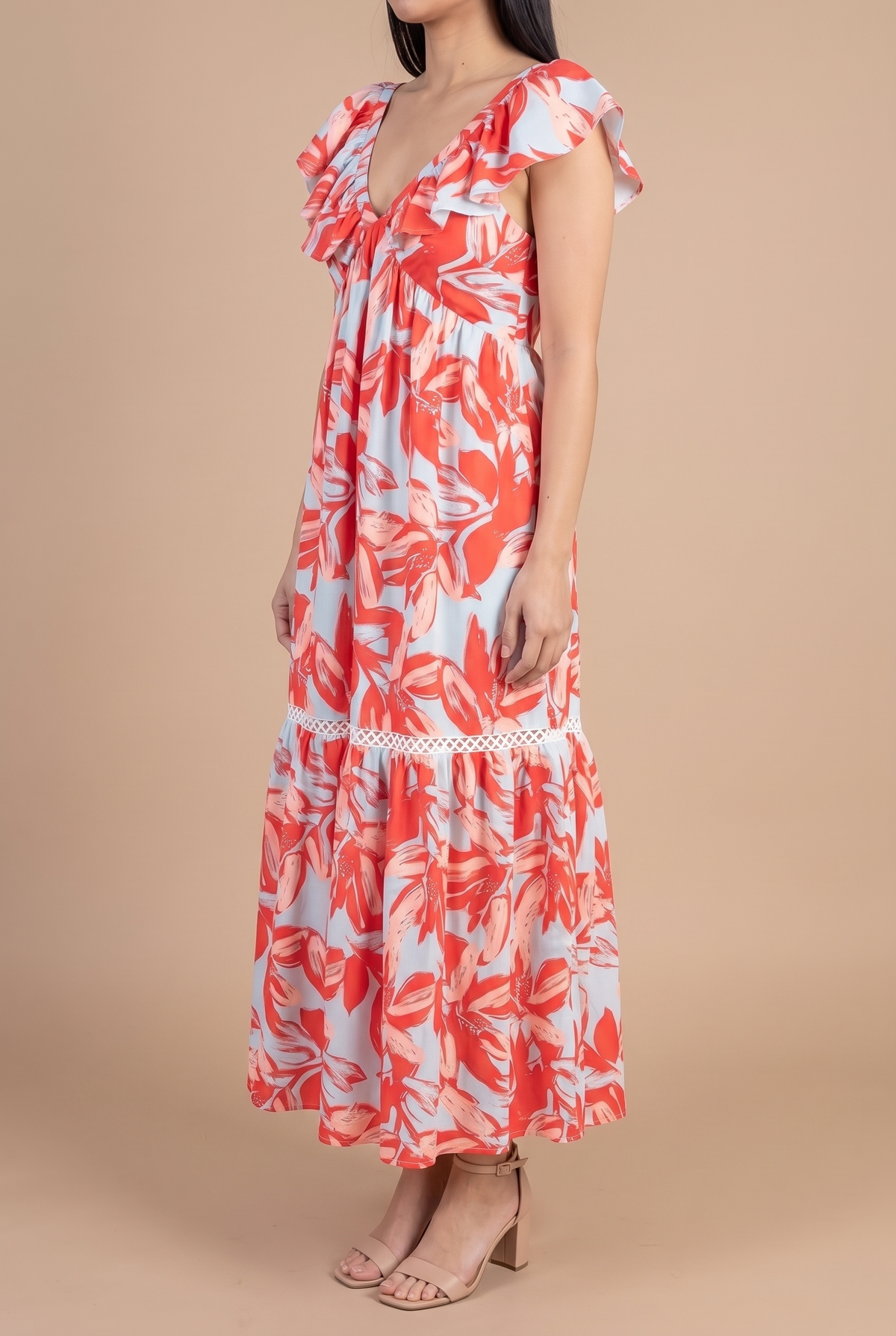 Side view of the Painted The Sky floral maxi dress, showing the empire seam, tiered skirt and ankle-length hem.