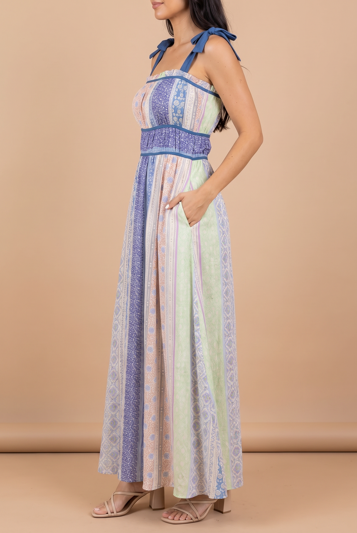 Side view of the Feeling The Sunshine maxi dress, with a hand in the side pocket.