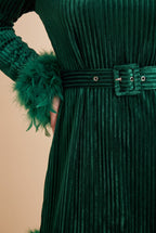 Close-up of the green velvet feather trim long sleeve mini dress, showing the velvet and the finishing details.