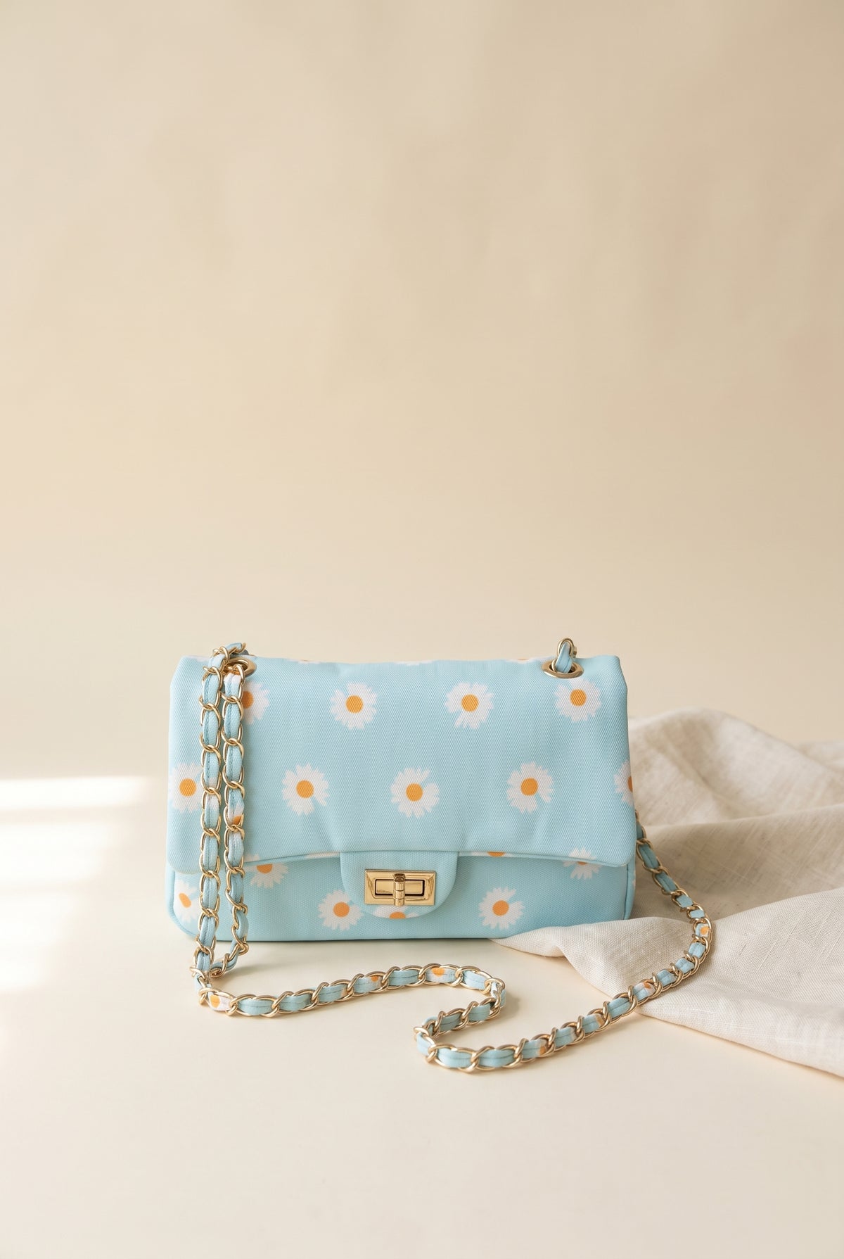 Vera Daisy Print Shoulder Bag, light blue daisy print flap bag with gold twist lock and fabric-woven gold chain