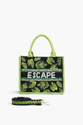 A tropical-themed tote bag featuring green leaf embroidery, sequin "ESCAPE" lettering, fabric-wrapped handles, and a detachable crossbody strap.