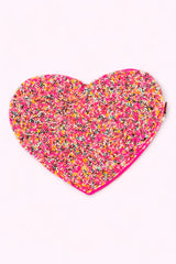 Colorful beaded heart-shaped clutch with a candy sprinkle design, perfect for adding a playful touch to any outfit.