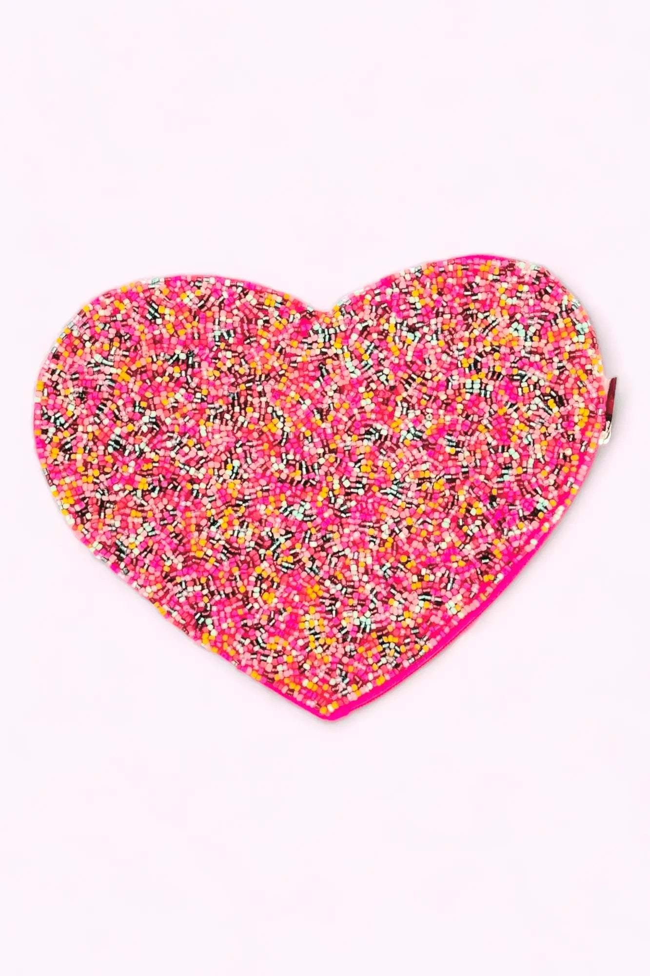 Colorful beaded heart-shaped clutch with a candy sprinkle design, perfect for adding a playful touch to any outfit.